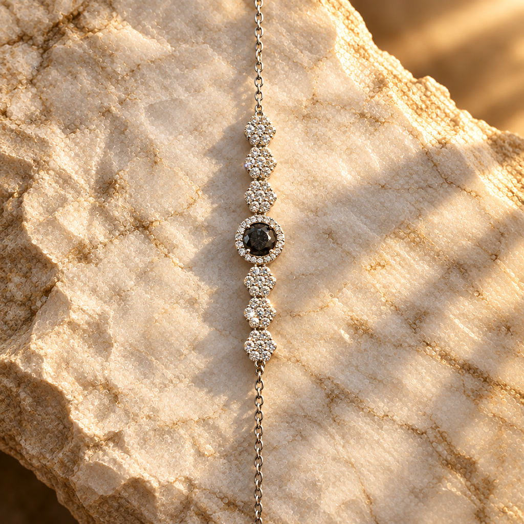 Black gemstone bracelet on marble, golden-hour