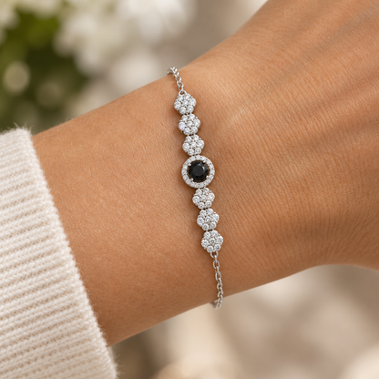 Black gemstone bracelet on model's wrist