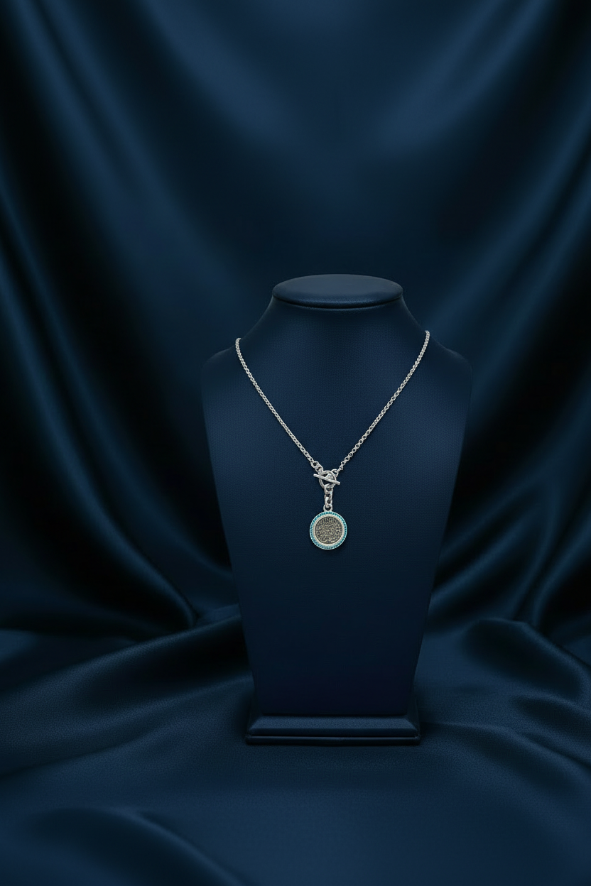 Turquoise Coin on Navy Bust